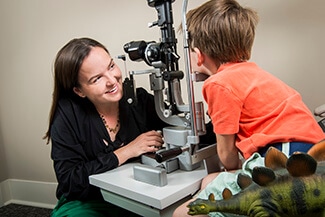 Eye Doctor with Young Patient