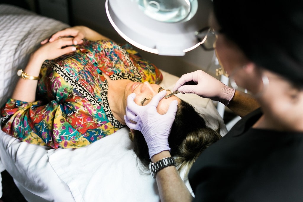Dermaplaning procedure in progress