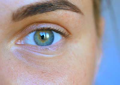 Close up of a woman's blue eye