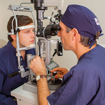 Dr Parisi Performing Eye Exam